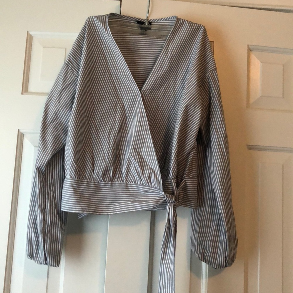Grey and white striped wrap blouse.